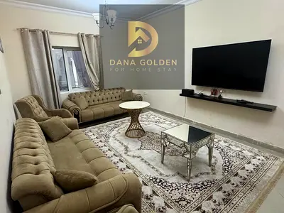 Two rooms, a hall, a large maid's room, a balcony with a beautiful view of all of Sharjah, a high floor, a large kitchen, and a master bedroom VIP