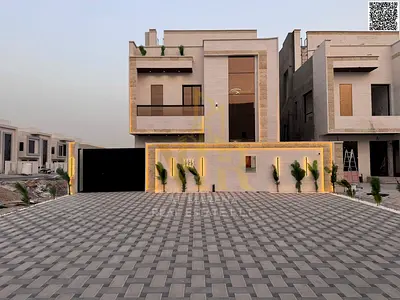 Luxury villa for sale in Al Zahia, Ajman, with a swimming pool and rooftop terrace, including registration and ownership fees, at a special price.