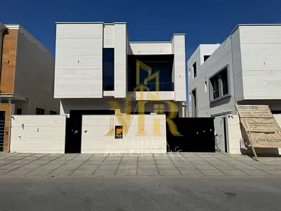 Modern villa for sale in Al Yasmin, 5 bedrooms with a roof terrace, including electricity, water, and air conditioning, at a special price.