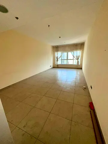 Two-bedroom apartment with a living room available for annual rent in the Asas Tower, Al Khan Corniche. Features include a balcony, swimming pool, gym