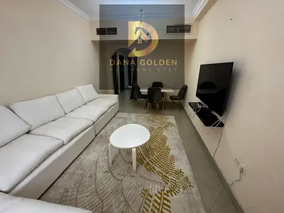 Two bedrooms, a living room, two bathrooms, and a balcony for monthly rent in Sharjah, Al Taawun area.