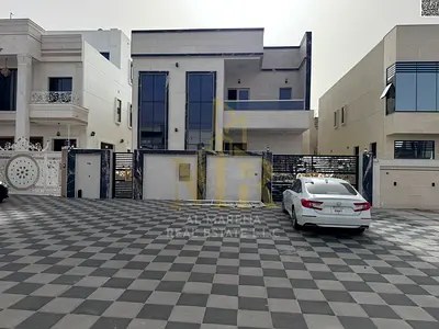 Villa for sale, freehold, open to all nationalities, near Sheikh Mohammed Bin Zayed Road, including registration and ownership fees.