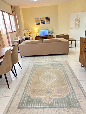 Light beige modern living room rug — good condition