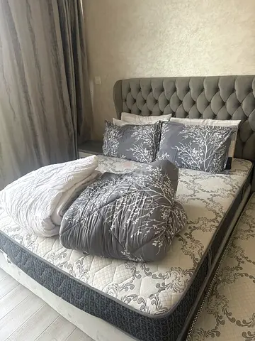 Queen size bed frame with mattress and bedding - grey tufted headboard