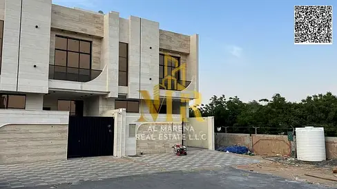 Two-story villa with a roof terrace, including registration and ownership fees, in one of Ajman's most prestigious areas. Freehold ownership available