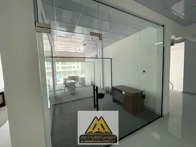 Offices of varying sizes with meeting rooms and lease agreements within a business center in the Mushrif area including bills. parking is available
