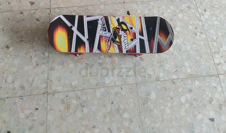 Used street skateboard with graphic deck - good condition