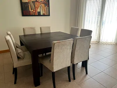 Solid Dark Wood 8 Seater Dining Table with Upholstered Chairs