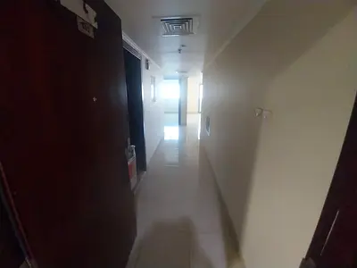 1BR apartment in Muwaileh Commercial with central AC, bathroom, balcony, prime location near all services, and easy access to Dubai.