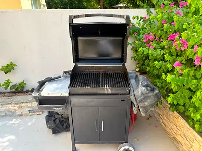 Used Charcoal/Propane Outdoor Grill with Storage Cabinet