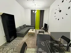 Furnished one-bedroom apartment with living room for annual rent, including private parking, located