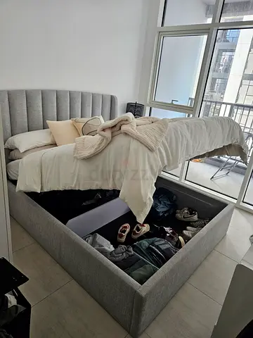 Grey upholstered storage bed with mattress included