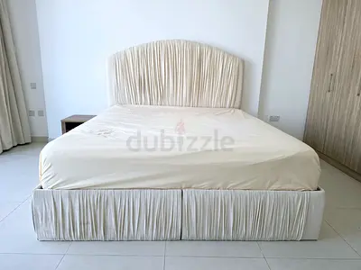 Cream Upholstered Double Bed with Pleated Headboard