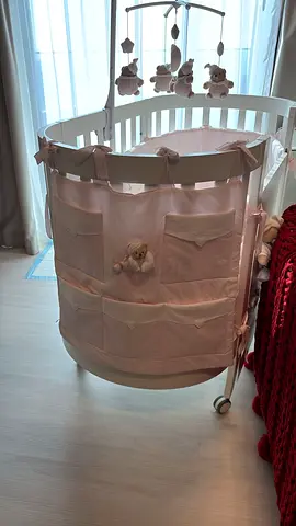 Nanan oval baby bassinet/crib with pink organizer and mobile — good condition