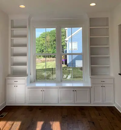 Custom Built-in Window Seat with Shelving and Cabinets - White