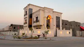 A luxurious classic villa with distinctive finishes, two floors and a rooftop with a swimming pool.