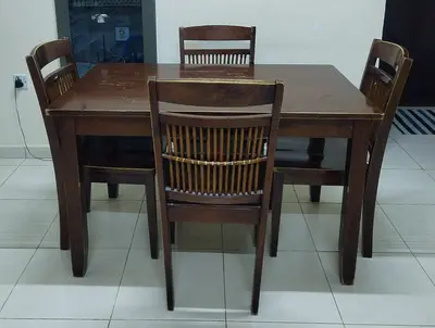 Solid wood rectangular dining table with four matching chairs