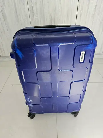 Blue hard-shell suitcase with wheels - medium/ large size, used