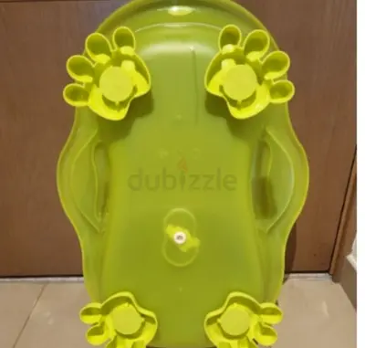 Green baby bathtub with non-slip paw grips