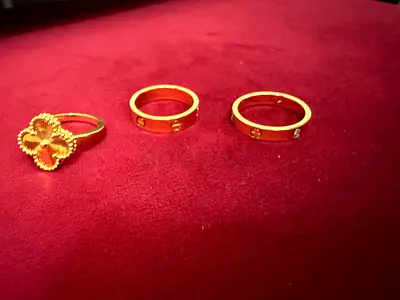 Set of 3 Gold Rings (one floral, two plain with small stones)