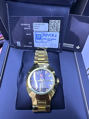 Gold-tone Rivol mens automatic watch with bracelet, box and papers