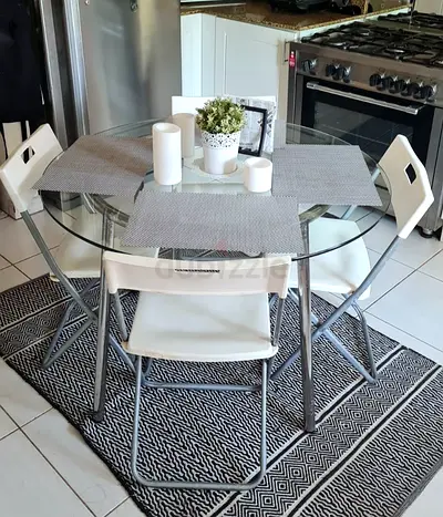 Round glass table with chairs