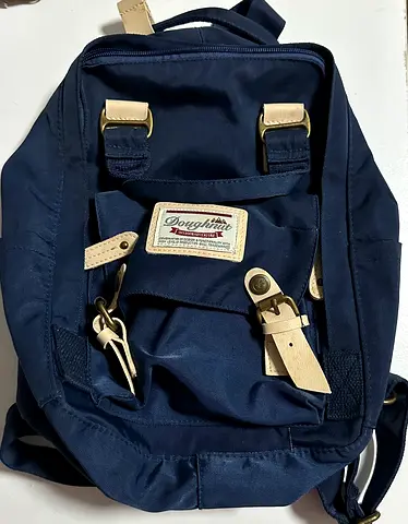 Navy Doughnut small backpack — used once and in great condition.