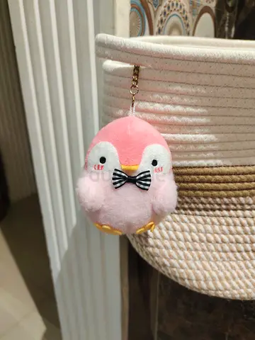 Small colorful plush-like fantasy puppy toy with rainbow hair