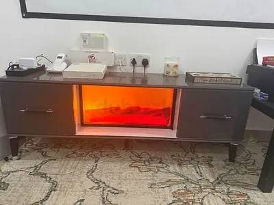 Dark wood TV cabinet with illuminated display shelf - good condition