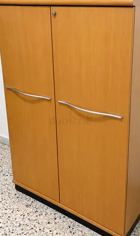 Light wood 2-door storage cabinet with lock — good condition