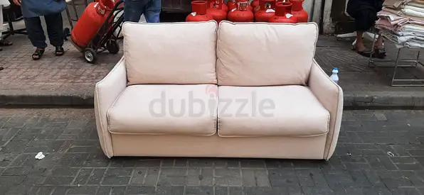 Beige 2-Seater Sofa - Comfortable, Good Condition