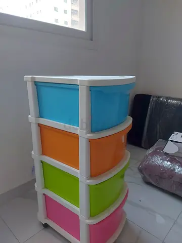 Colorful cosmoplastic 4-tier plastic storage drawers.