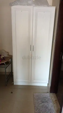 White freestanding 2-door wardrobe / storage cabinet - good condition
