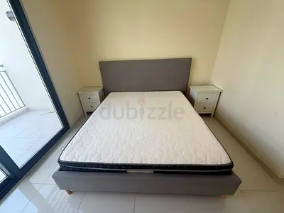 Grey fabric King bed frame with mattress - good condition