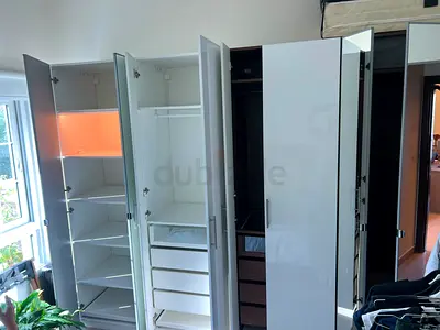 White glossy 4-door wardrobe with drawers and shelves - good condition