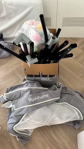 RuiHhome Baby Playpen with Poles and playing balls.
