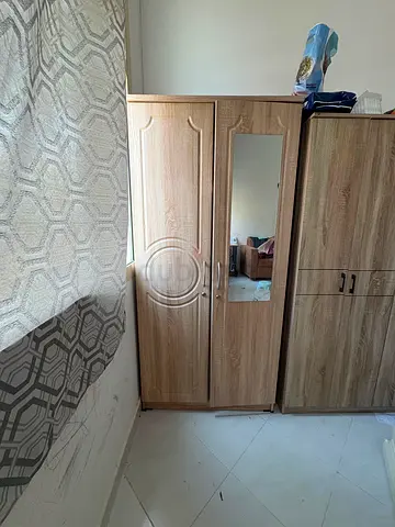 Two-door wooden wardrobe with mirror - good condition