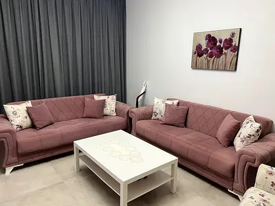 Set of 2 pink fabric sofas bed with cushions - good condition
