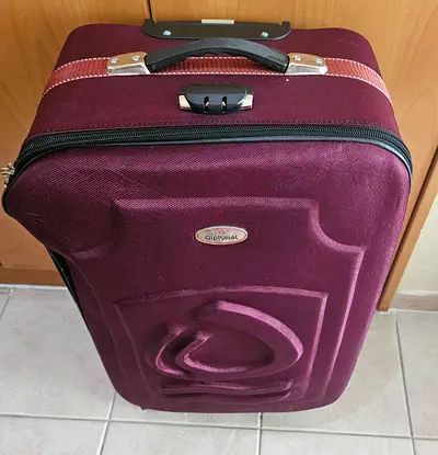 Used maroon soft-shell carry-on suitcase - good condition