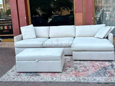 Cratebarrel lounge deep L shape sofa and footstool under Coffee table
