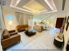 Furnished villa for sale in Ajman | Al Helio 1 area | 5 rooms, majlis, 2 halls and roof | Freehold o