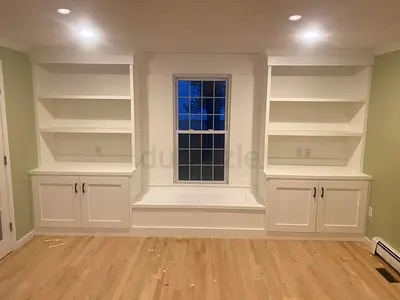 Custom Built-in Window Seat with Flanking Bookcases - White