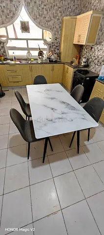 Dining table with 5 chairs — marble-look top, good condition