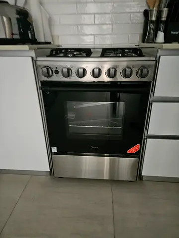 Stainless Steel Gas Range with Oven - Good Working Condition