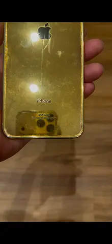 Used 24k gold-plated iPhone (back shown) - good cosmetic condition from Gildgenie Dubai