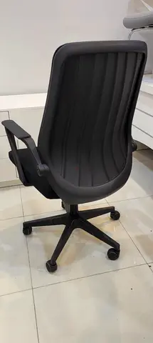 Black ergonomic office chair with armrests and wheels - good condition