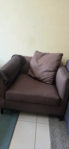Single brown fabric armchair in good condition
