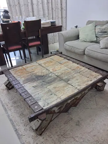 Rustic reclaimed wood low coffee table with carved metal trim