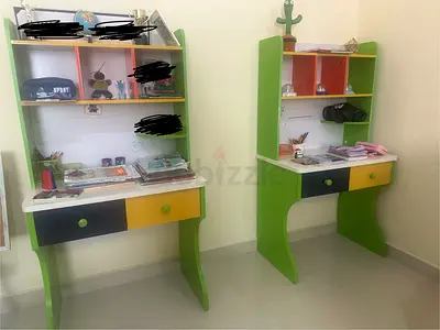 Pair of kids study desks with shelves and drawers - green/yellow