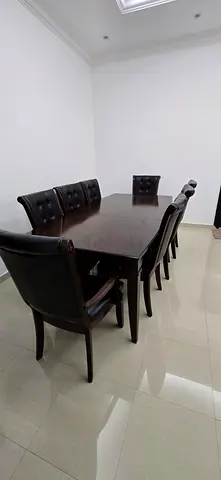 Solid Wood 8-Seater Dining Table with Leather Chairs